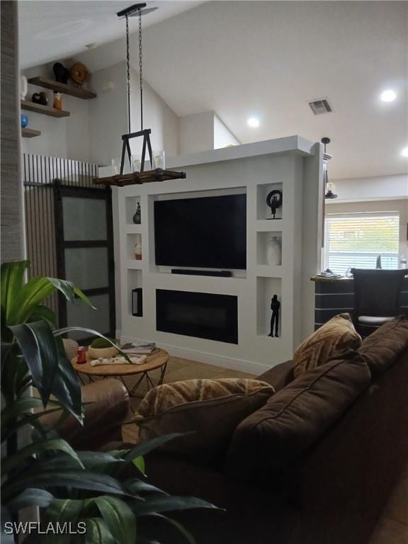 living room with lofted ceiling and built in features