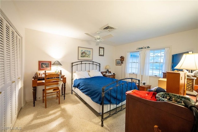 bedroom featuring ceiling fan and a closet