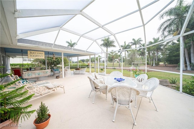 view of patio / terrace featuring glass enclosure