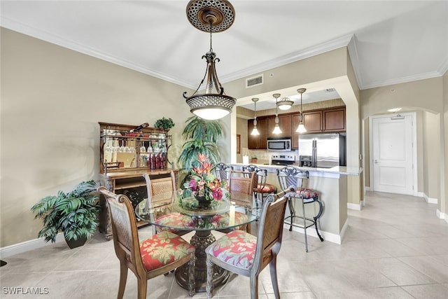 tiled dining space with crown molding