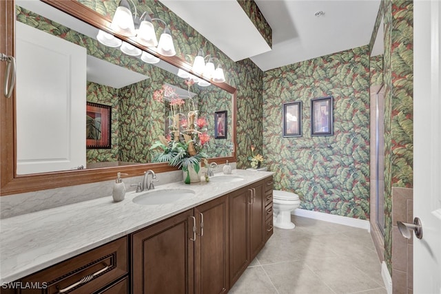 bathroom featuring tile patterned flooring, vanity, and toilet