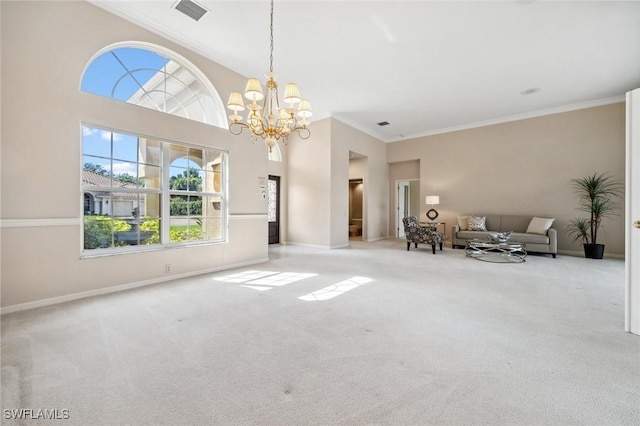 unfurnished living room featuring light colored carpet, ornamental molding, and a notable chandelier