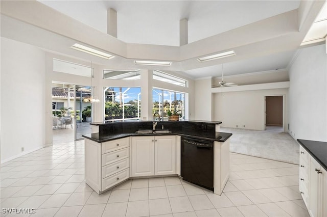 kitchen with sink, light tile patterned floors, dishwasher, ceiling fan, and white cabinets