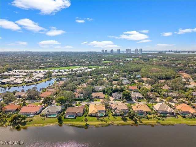 drone / aerial view with a water view and a residential view