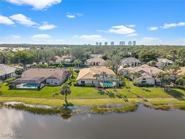 birds eye view of property featuring a water view