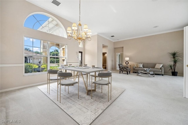 dining area with ornamental molding, visible vents, and carpet flooring