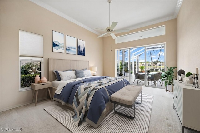 bedroom featuring ornamental molding, access to exterior, a sunroom, and light carpet