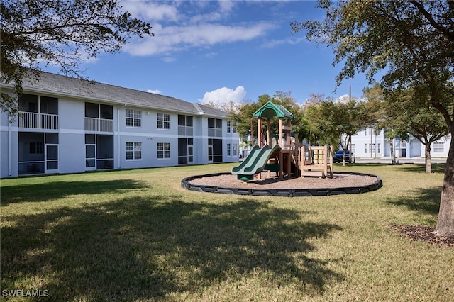 view of play area featuring a lawn