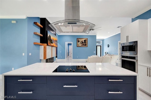 kitchen with ornamental molding, light stone countertops, white cabinets, and appliances with stainless steel finishes