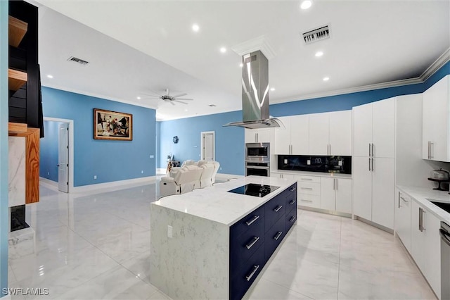 kitchen with white cabinetry, tasteful backsplash, island range hood, ornamental molding, and a kitchen island