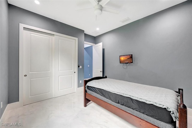 bedroom featuring ceiling fan and a closet