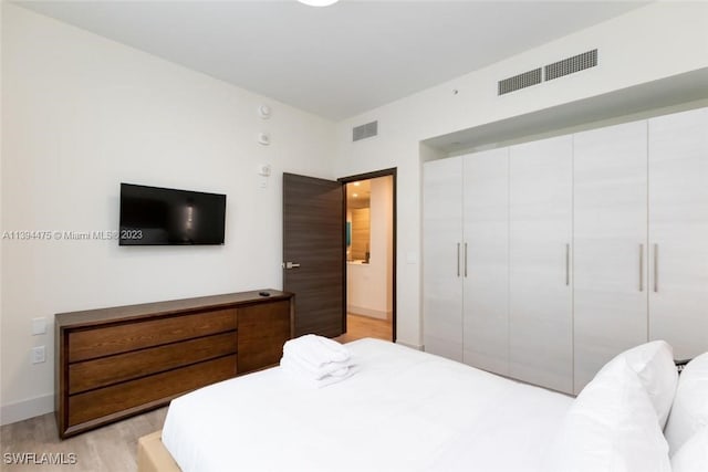 bedroom with light wood-type flooring