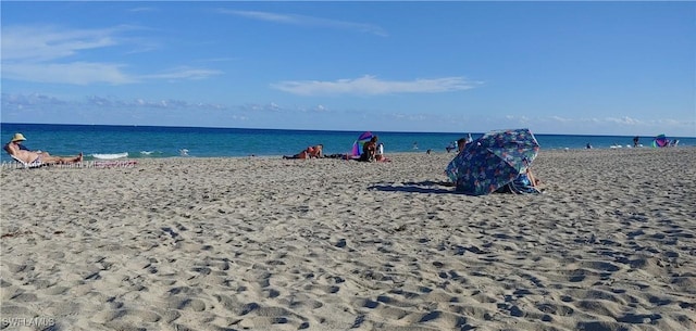 property view of water featuring a beach view