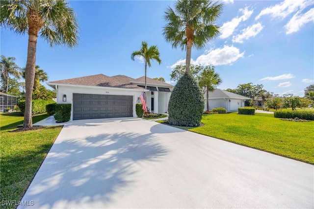 ranch-style home featuring a garage and a front yard