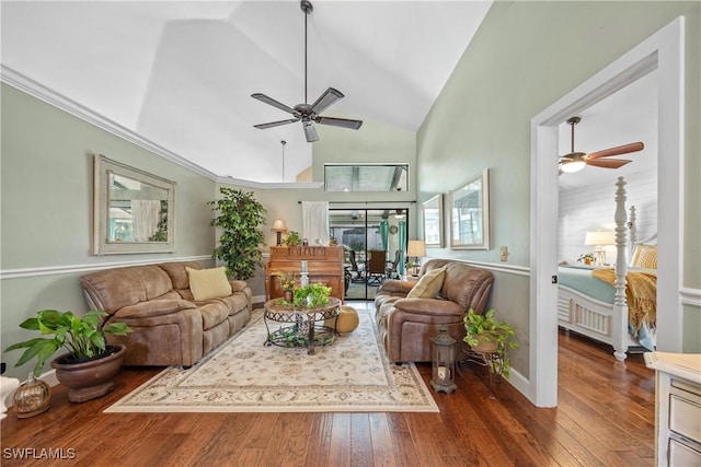 living room featuring dark wood-type flooring, ceiling fan, and high vaulted ceiling