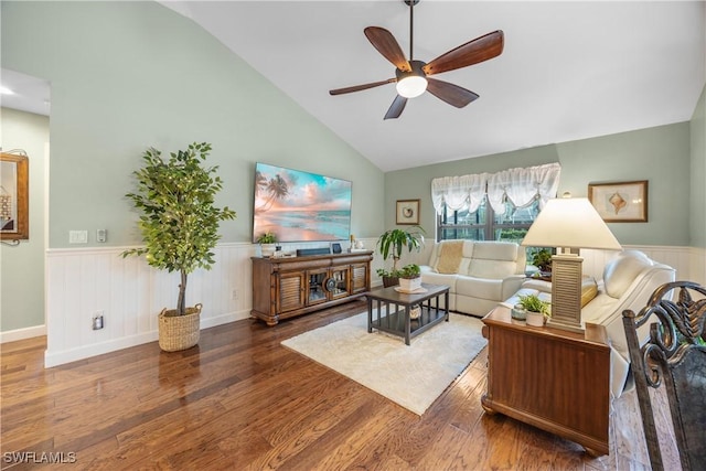 living room featuring ceiling fan, dark hardwood / wood-style flooring, and high vaulted ceiling