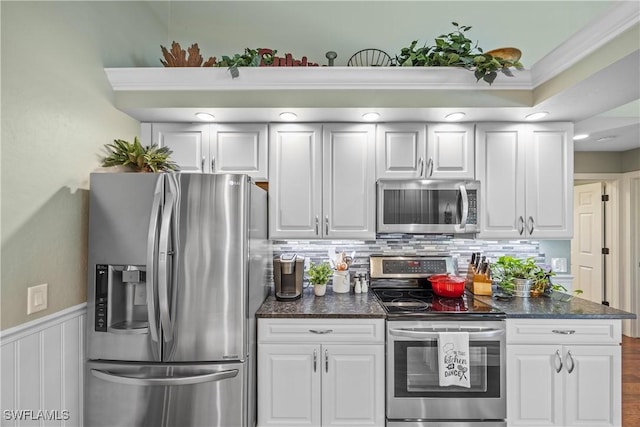 kitchen with stainless steel appliances and white cabinets