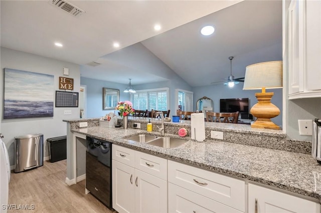 kitchen featuring dishwasher, light stone countertops, sink, and white cabinets