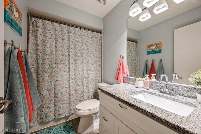 bathroom with vanity and toilet