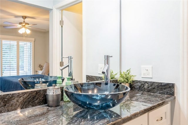 bathroom featuring ceiling fan and vanity