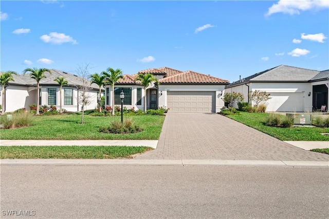 view of front of property featuring a garage and a front yard