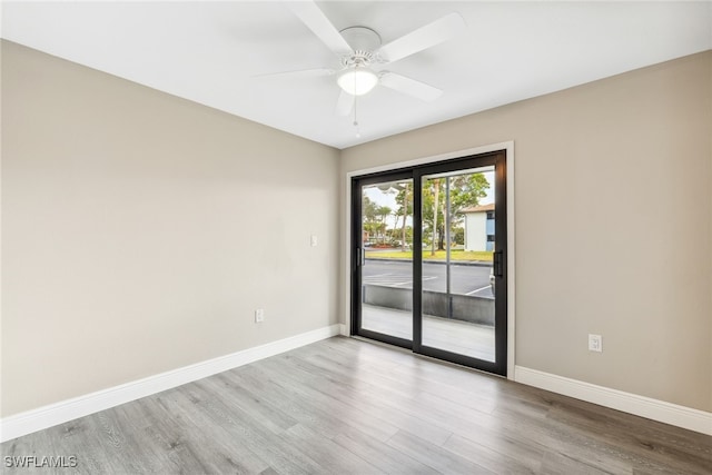 unfurnished room featuring ceiling fan and light hardwood / wood-style flooring