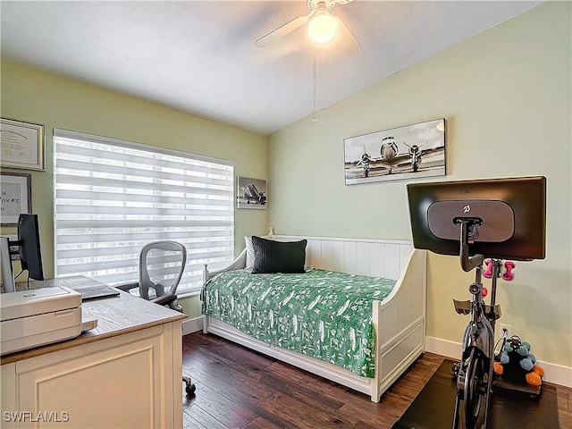 bedroom with lofted ceiling, dark hardwood / wood-style floors, and ceiling fan