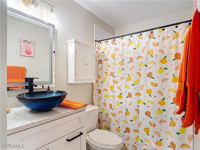 bathroom with a shower with curtain, vanity, and toilet