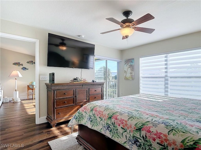 bedroom featuring dark wood-type flooring, access to outside, and ceiling fan