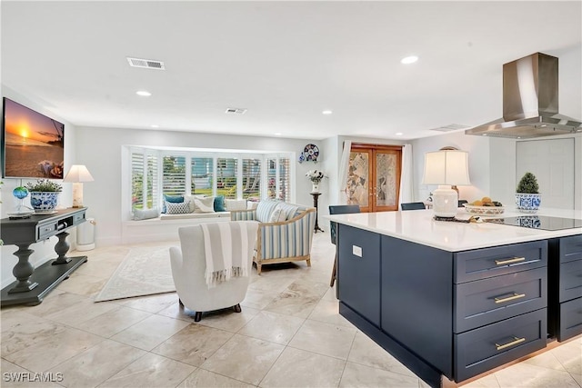 kitchen featuring black electric cooktop, island range hood, french doors, and a kitchen island