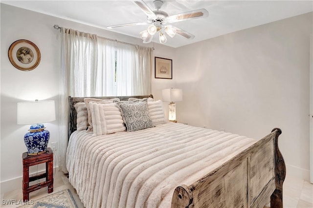 tiled bedroom featuring ceiling fan