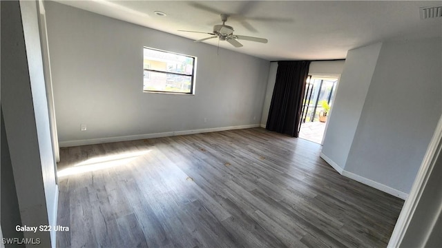 spare room with ceiling fan and hardwood / wood-style floors