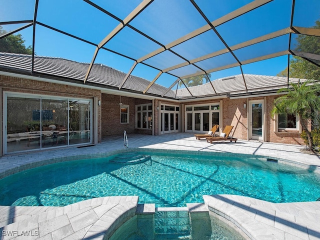 view of pool with a lanai and a patio area