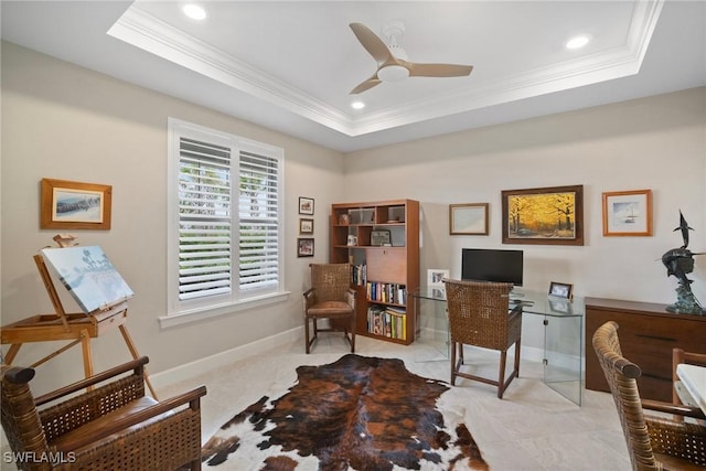 home office featuring a tray ceiling, crown molding, and ceiling fan