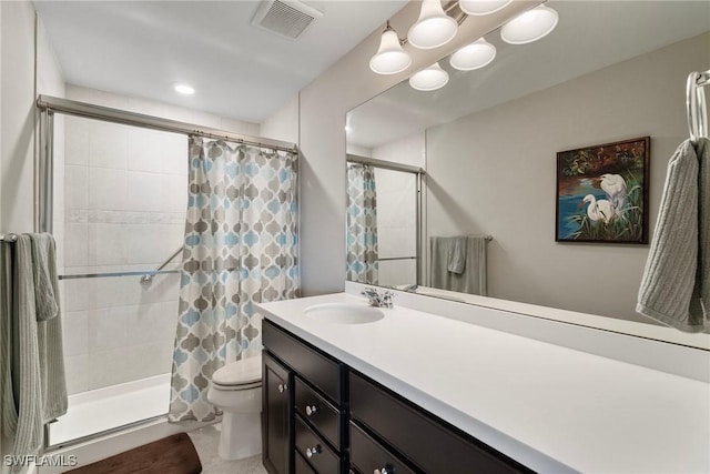 bathroom with vanity, a shower with curtain, and toilet