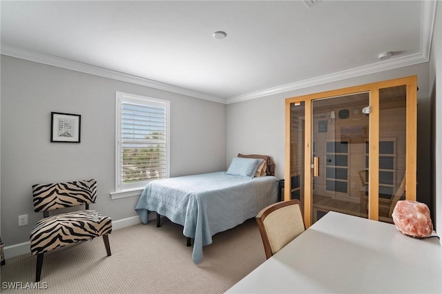 bedroom with ornamental molding and carpet flooring