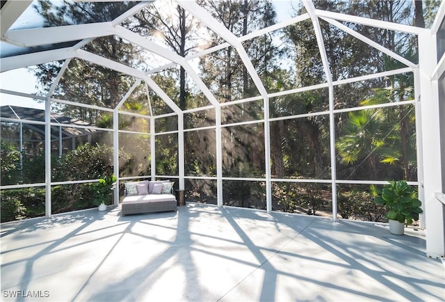 view of patio / terrace featuring a lanai