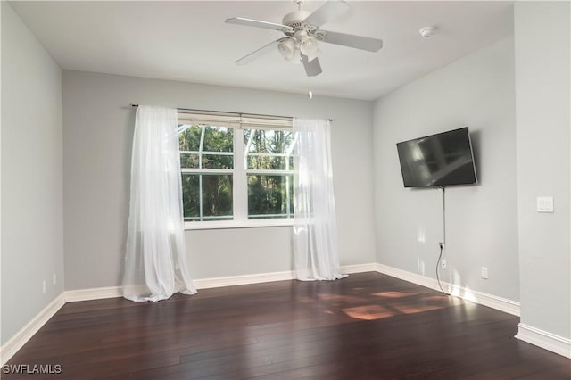 unfurnished living room with ceiling fan and dark hardwood / wood-style floors