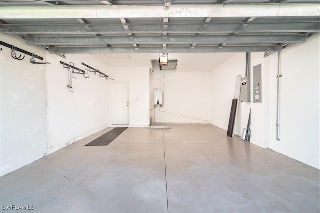 garage featuring electric panel and tankless water heater