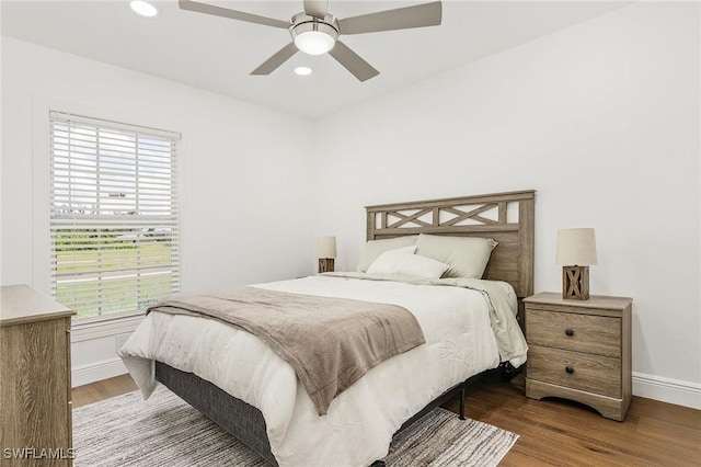 bedroom featuring wood-type flooring and ceiling fan