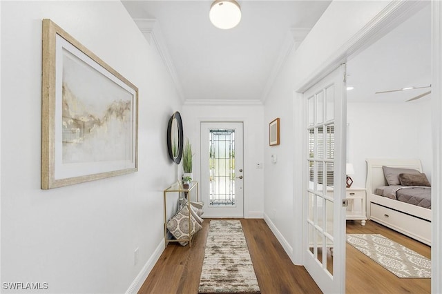 entryway featuring hardwood / wood-style flooring and ornamental molding