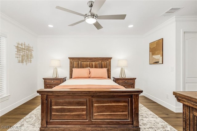 bedroom with ceiling fan, ornamental molding, and dark hardwood / wood-style flooring