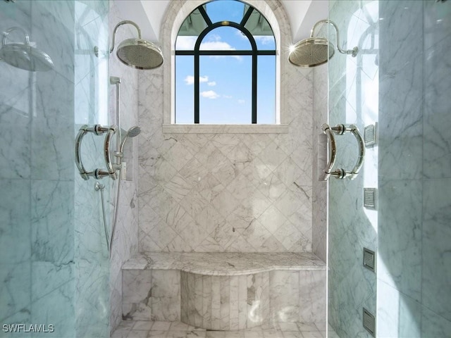 bathroom with a tile shower