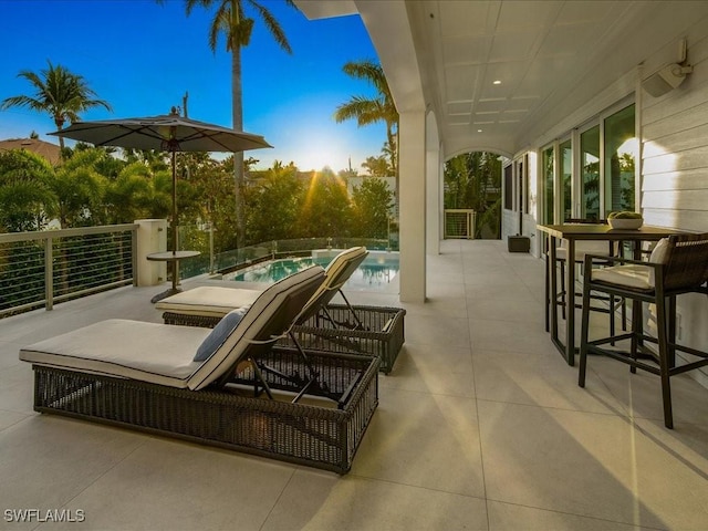 view of patio / terrace with a fenced in pool