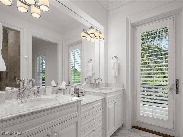 bathroom with crown molding and vanity