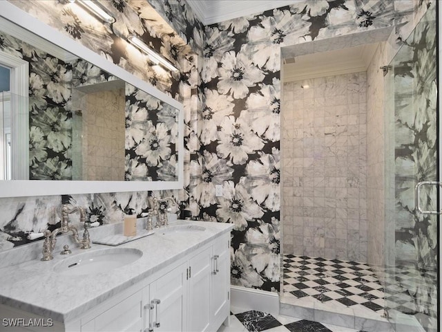 bathroom with ornamental molding, a shower with shower door, and vanity