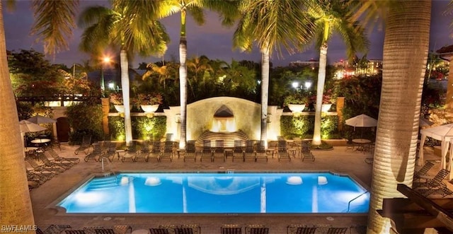 view of swimming pool with a patio and exterior bar