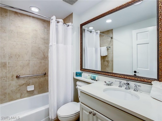 full bathroom featuring vanity, shower / bath combination with curtain, and toilet