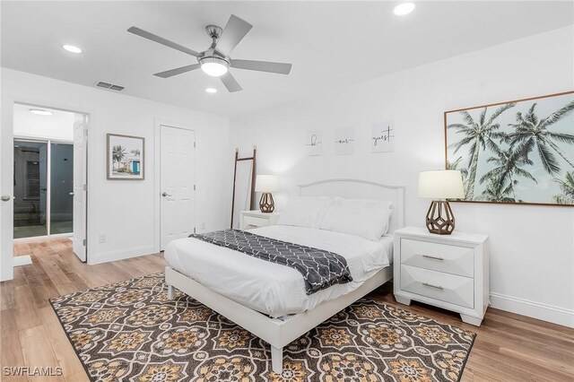 bedroom with ceiling fan and light hardwood / wood-style floors