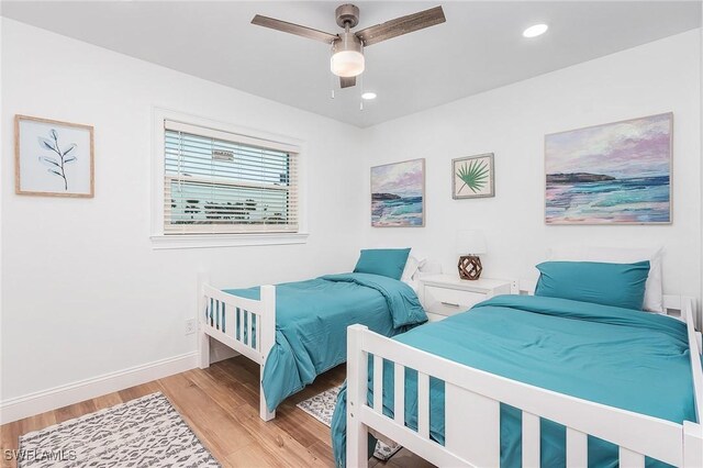 bedroom featuring ceiling fan and light wood-type flooring